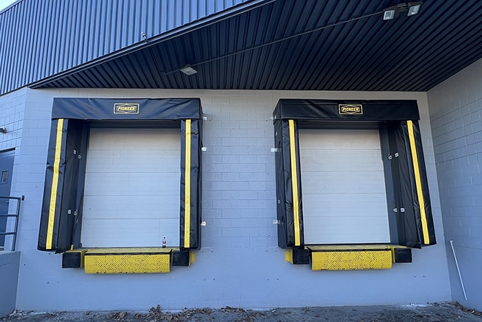 Dock shelter with heavy-duty bumpers installed